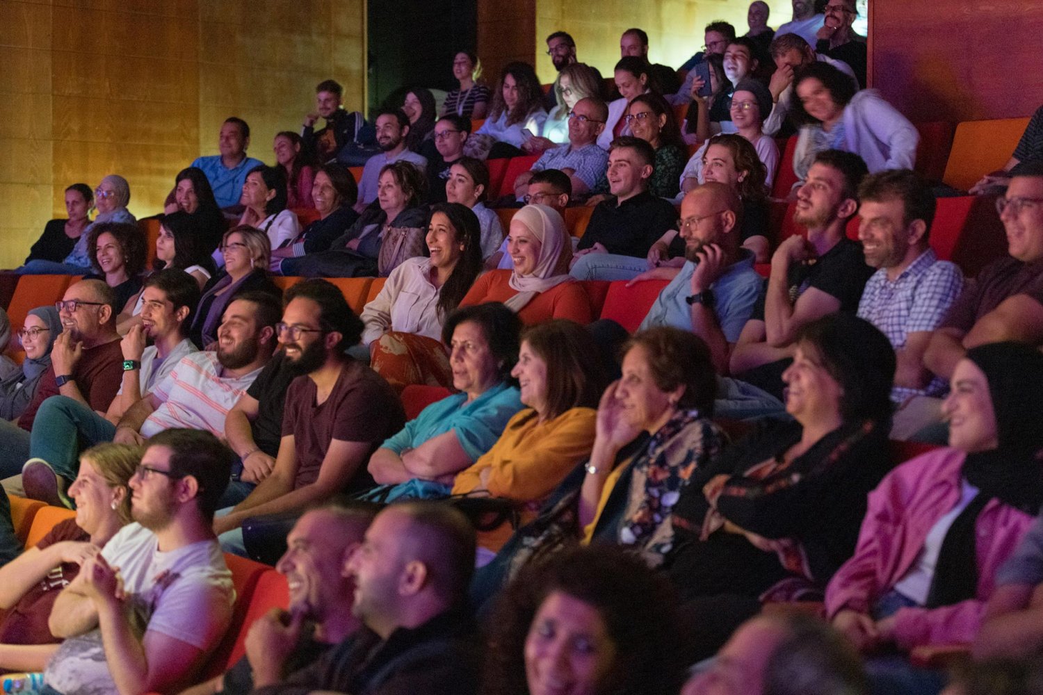 Audience enjoys Nidal Badarneh's stand-up show at a music festival in Jerusalem on September 19, 2022
