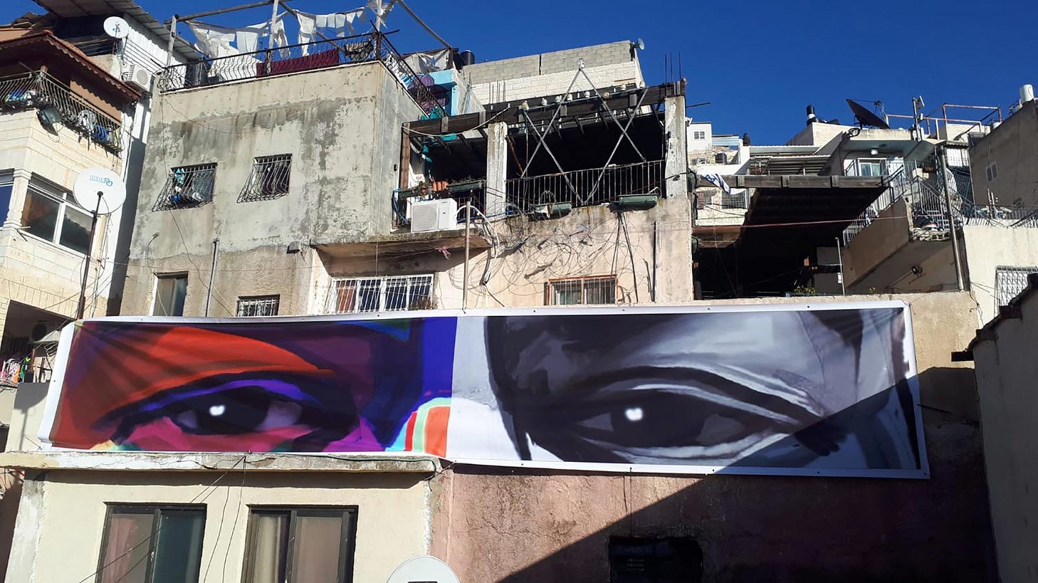 “Eyes of George Floyd,” a mural erected as part of the “I Witness Silwan” art installation in Batn al-Hawa, Silwan, East Jerusalem