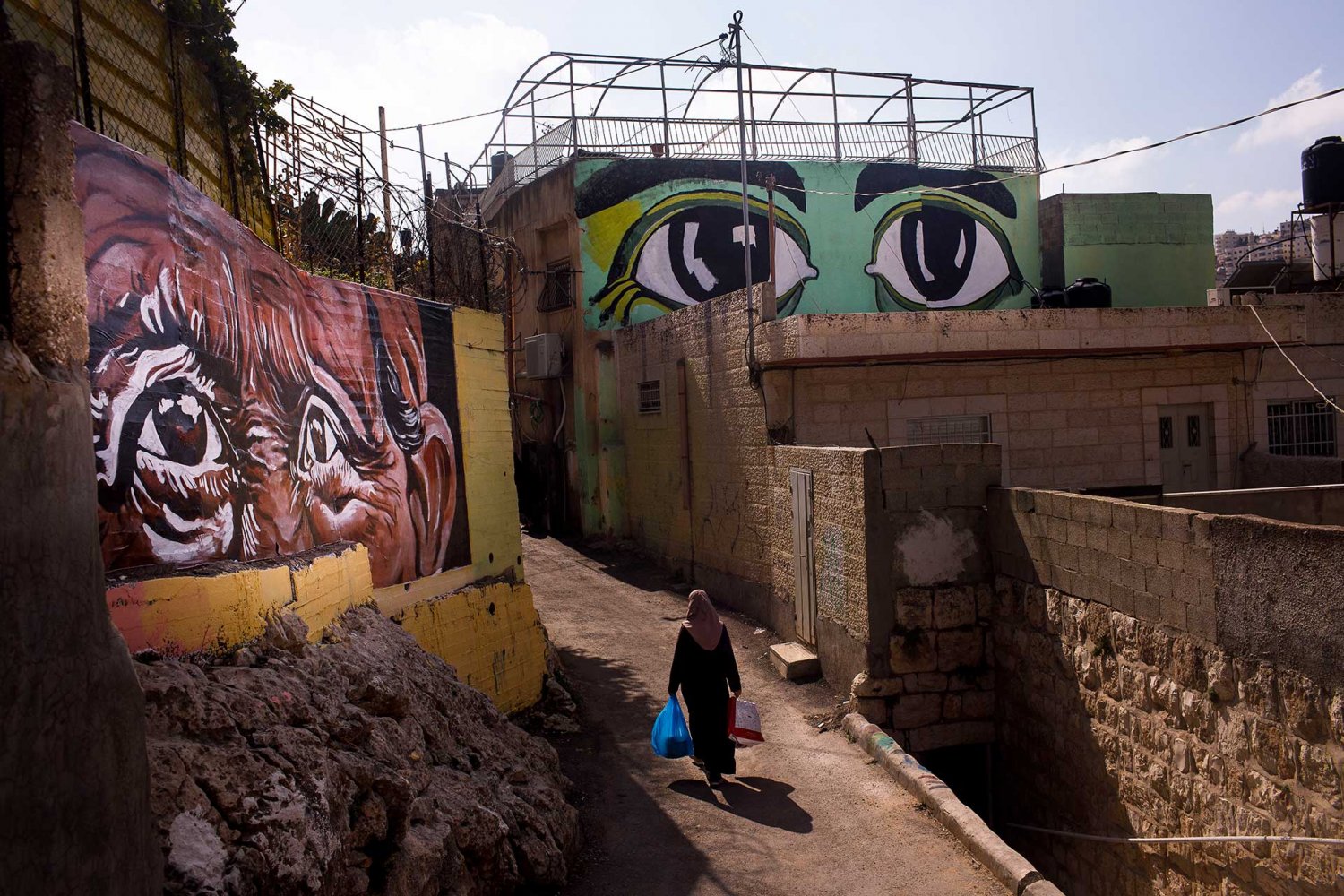 Different sets of eyes painted on homes in Silwan, East Jerusalem, in an art installation