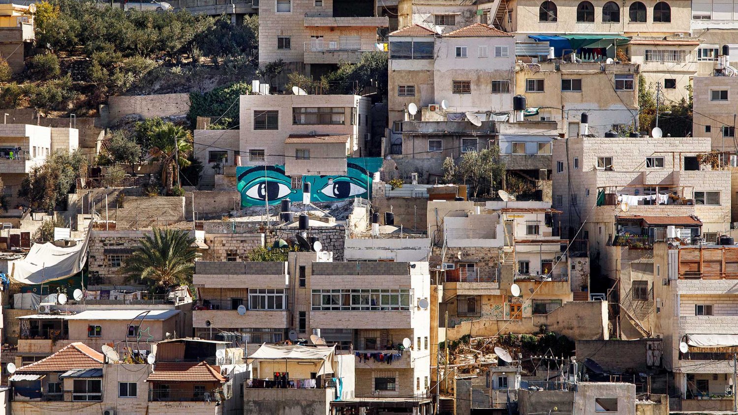 Grafitti eyes painted on homes in Silwan, Jerusalem, as part of an art installation