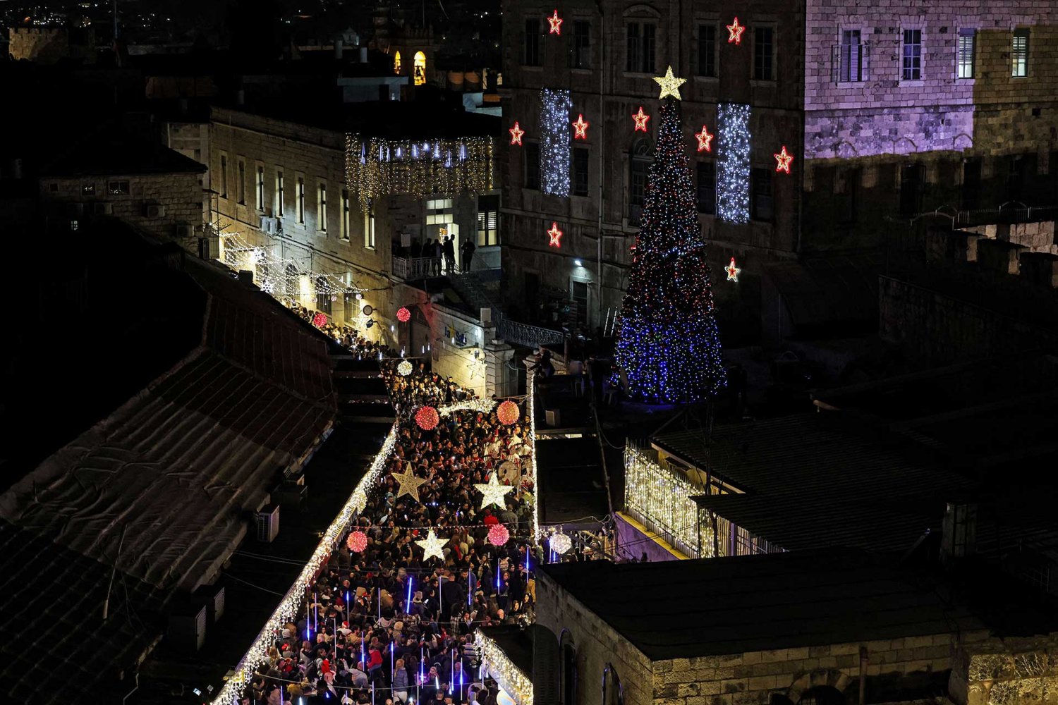 Christmas festivities in Jerusalem's Old City photographed from the rooftops above