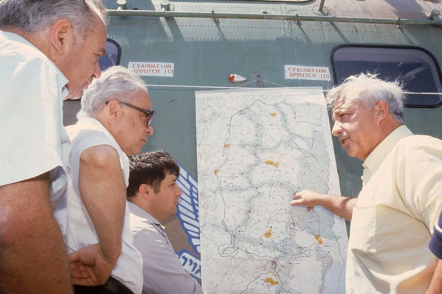 Israeli Minister of Agriculture Ariel Sharon shows a map of West Bank settlements, in Israel, July 1979.