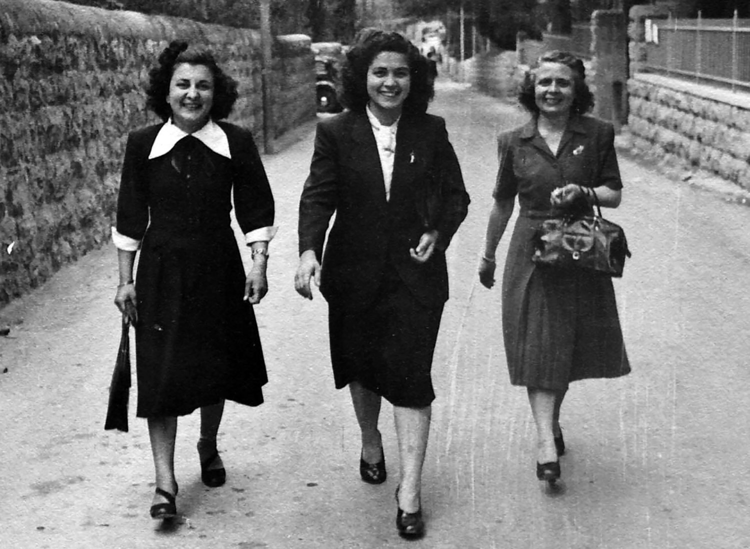 Linda Farradj, Zakia Jabre, and Virginie Farradj walk in the German Colony in Jerusalem, 1940s