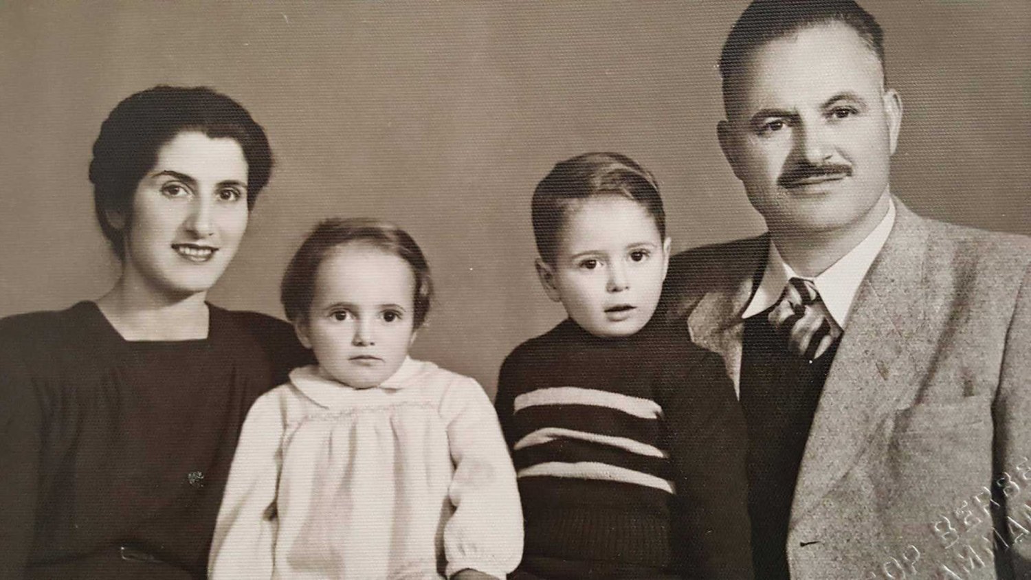 Mary Qamar and Gregory Farah with their children, Grace and John, ca. 1947