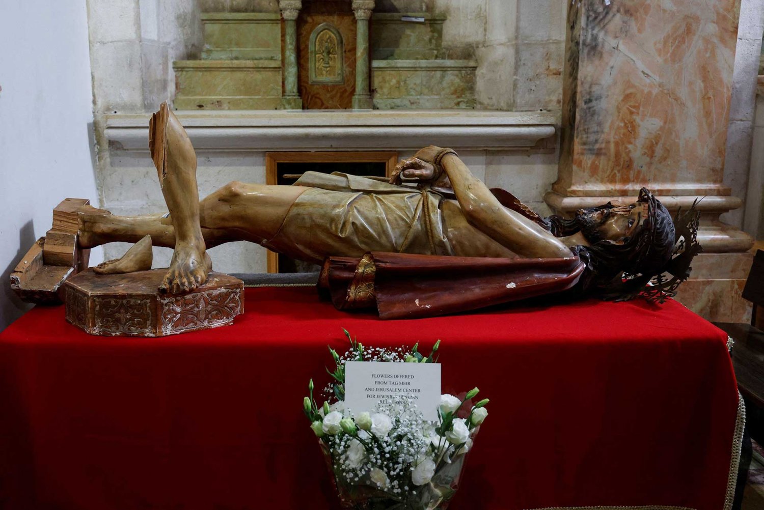 A statue of Jesus Christ, defaced and toppled, in the Church of the Flagellation, Jerusalem, February 2, 2023