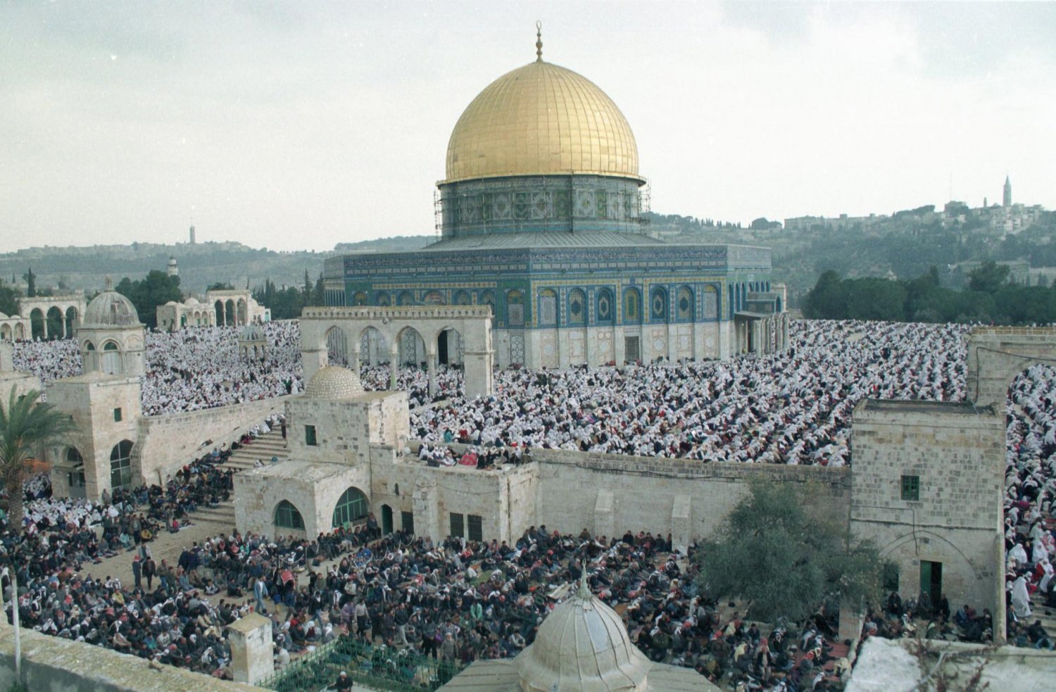 Muslims gather on the grounds of the al-Aqsa Mosque to perform Ramadan prayers in 1996.