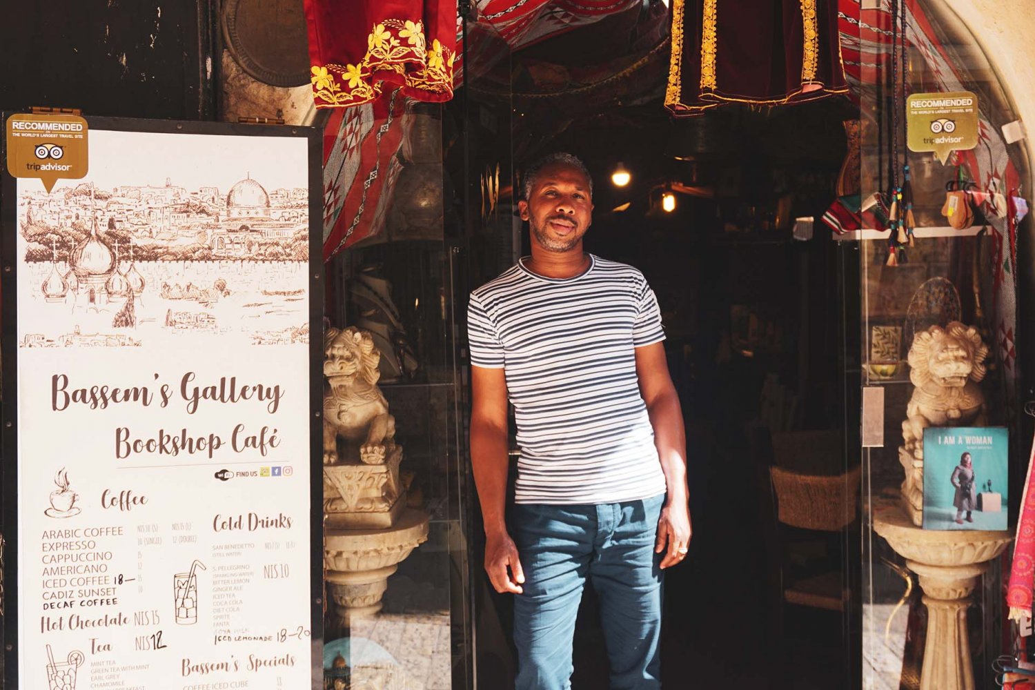 Shopkeeper Issam stands outside Bassem’s Gallery & Café along the Via Dolorosa in Jerusalem’s Old City