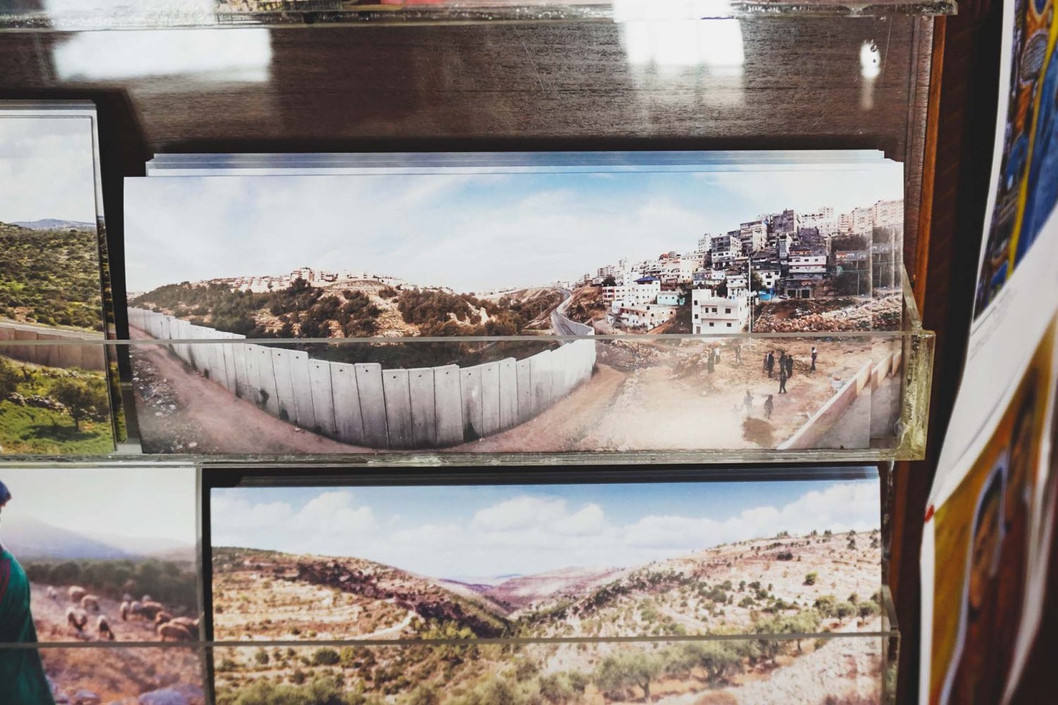 A display of photographs at Bassem’s Gallery & Café portrays the Separation Wall.