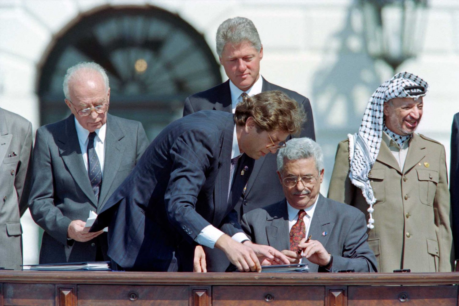 Mahmoud Abbas signs the Oslo 1 Accord (Declaration of Principles) in Washington DC for the PLO, September 13, 1993.