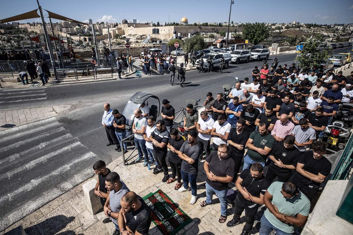 Barred by Israel from accessing al-Aqsa Mosque for Friday prayer, Palestinian Muslims pray on the street in the Ras al-Amud neighborhood of East Jerusalem, Friday October 13, 2023.