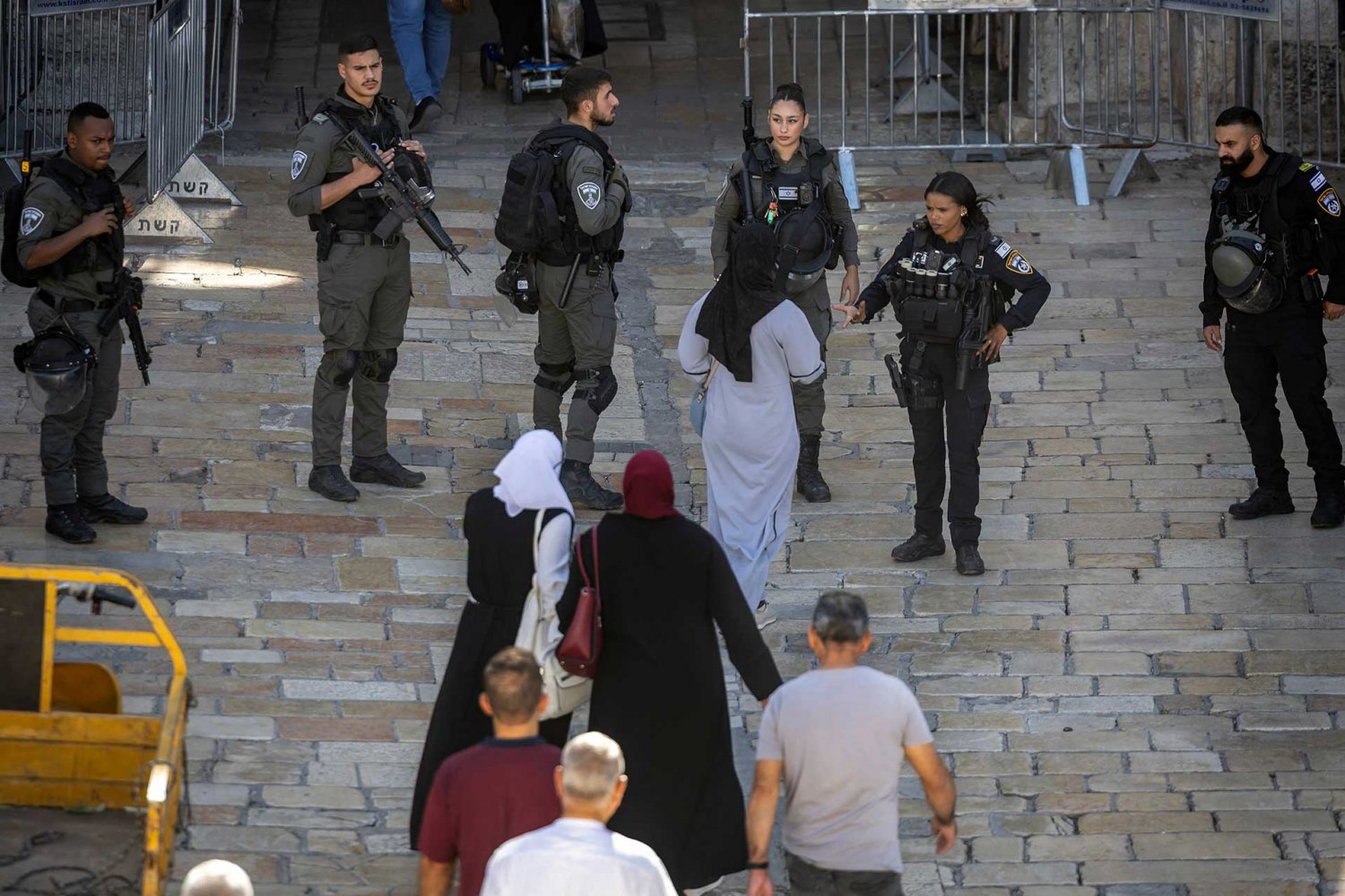 Israeli border police forces inspect people entering Jerusalem’s Old City through Damascus Gate, November 6, 2023.