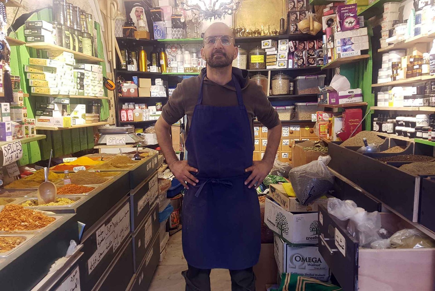 Jerusalemite merchant Riad Idais stands in his spice shop in the Old City of Jerusalem, where business has come to a standstill, , November 23, 2023.