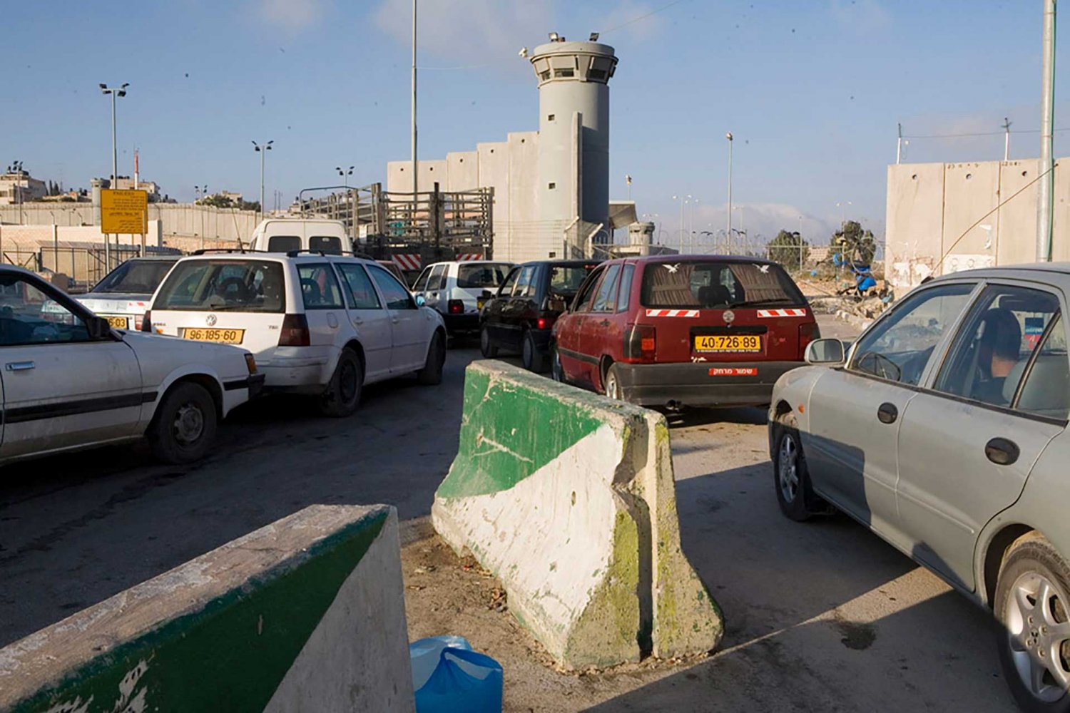 Cars wait in line at the Qalandiya checkpoint, which has seen long delays during Israel’s war on Gaza in the fall of 2023