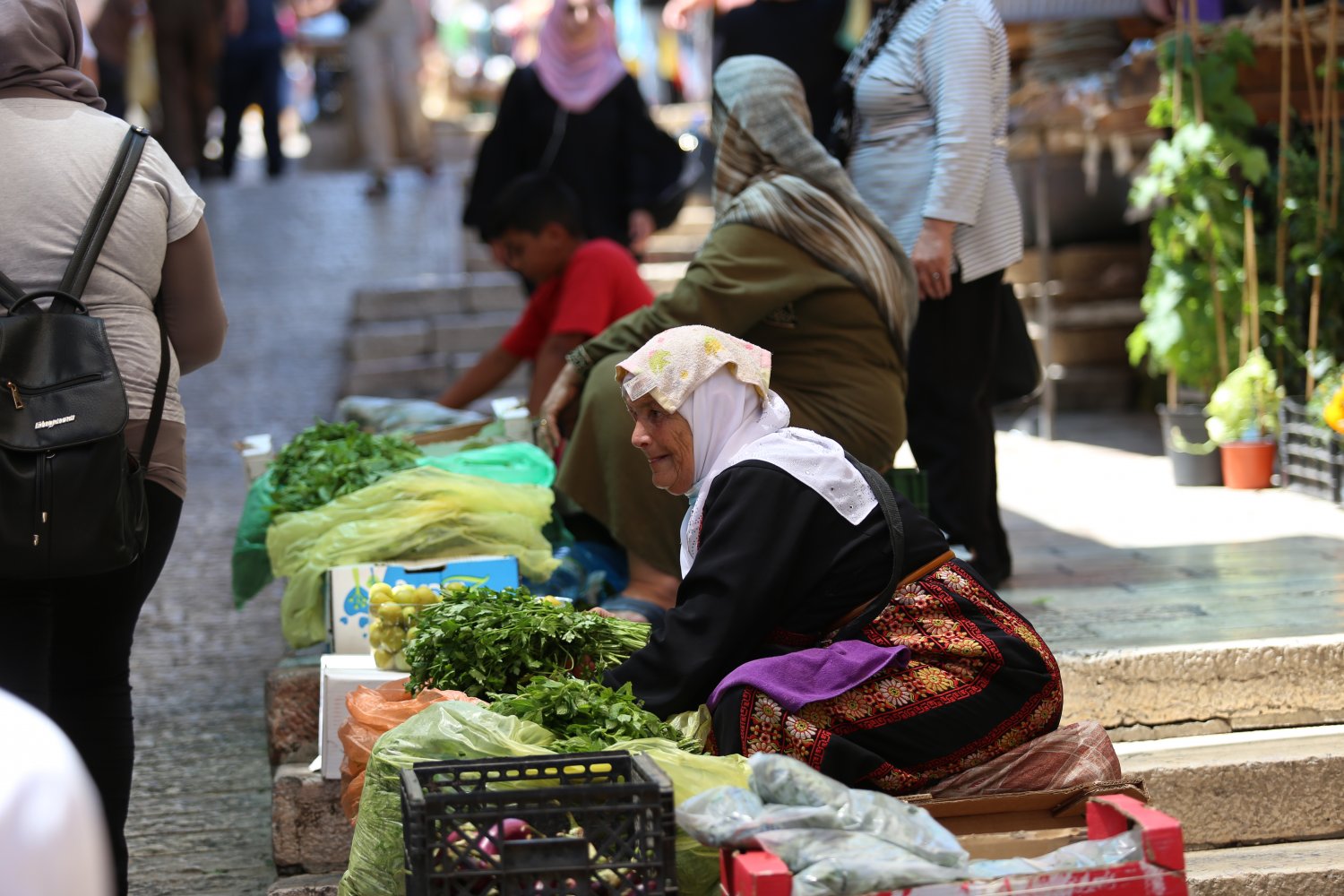 A Palestinian villager sells produce in the Old City of Jerusalem, June 2021.