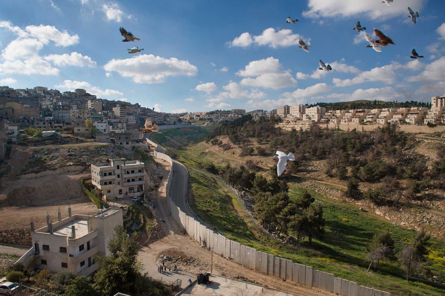 Comparison view of the Palestinian neighborhoods of Shu'fat / Shu‘fat refugee camp (left) and the Israeli Jewish settlement of Pisgat Ze’ev (right), which lies on the “Jerusalem” side of the Separation Wall. April 3, 2017. 