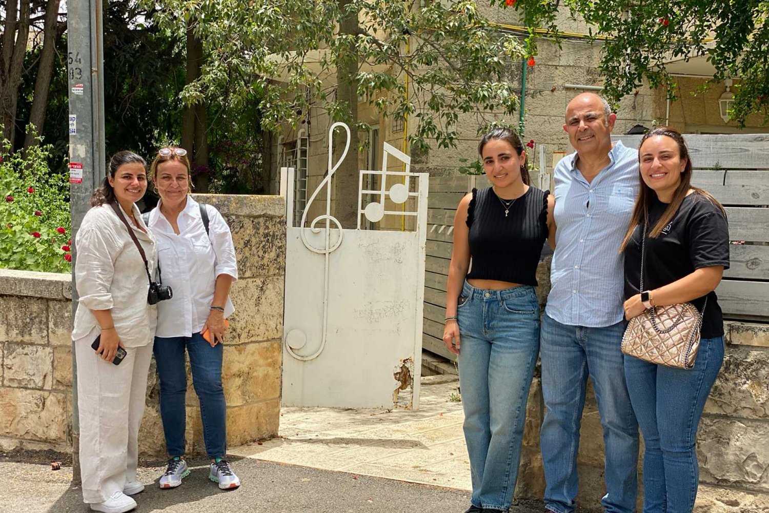 The Hammoudi family at the house their grandfather built in Qatamon, Jerusalem in the 1930s