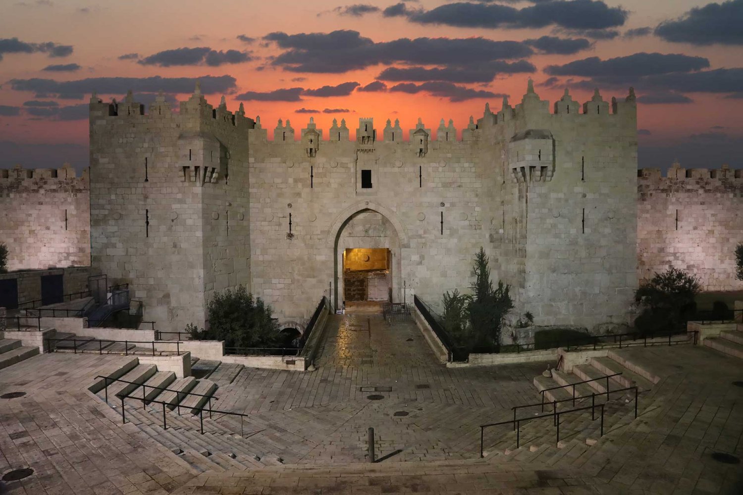 Damascus Gate to Jerusalem’s Old City stands empty at sunset.