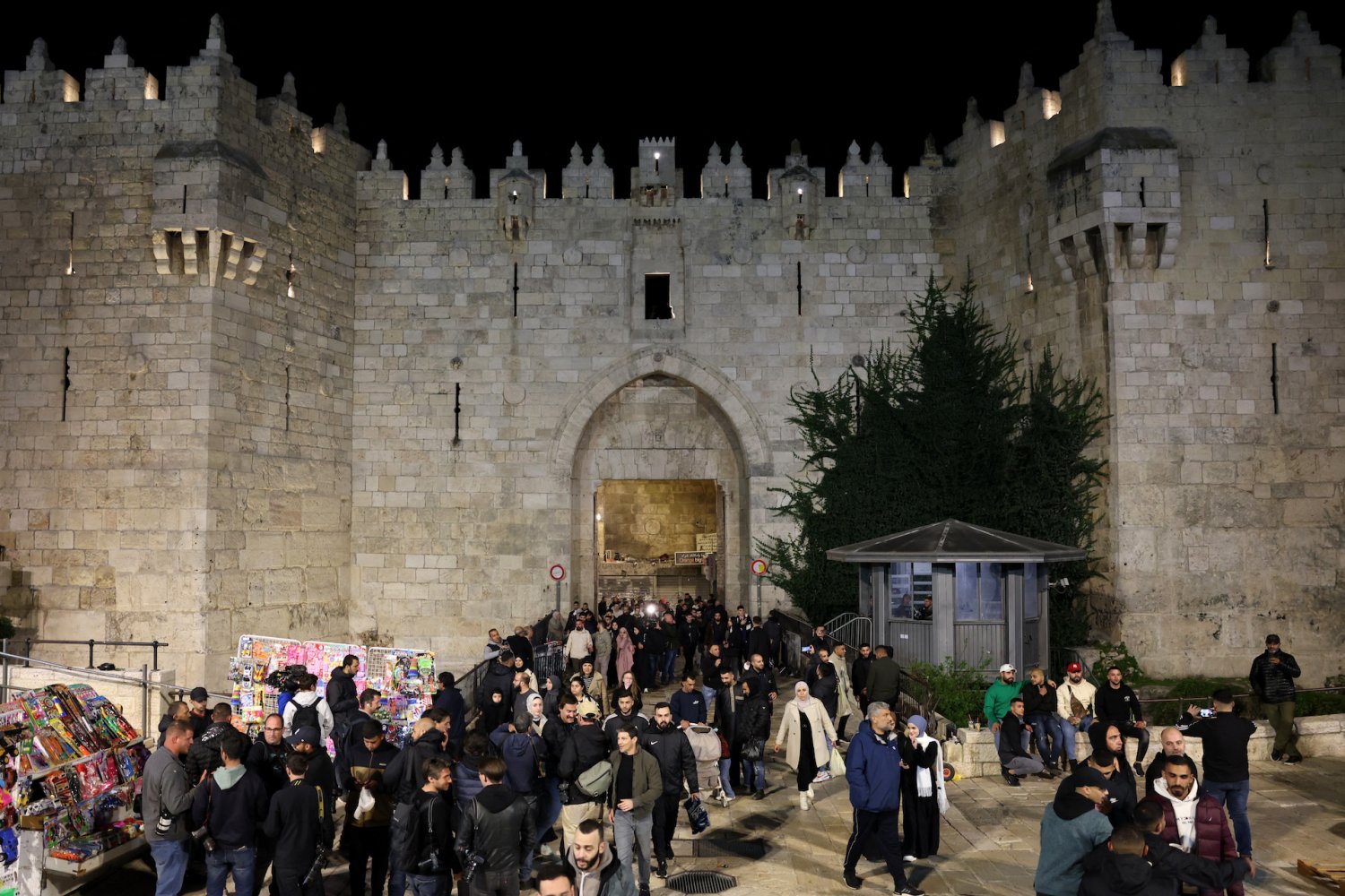 Palestinians exit Damascus Gate from the Muslim Quarter on the first night of Ramadan, March 11, 2024, after performing the evening prayer.