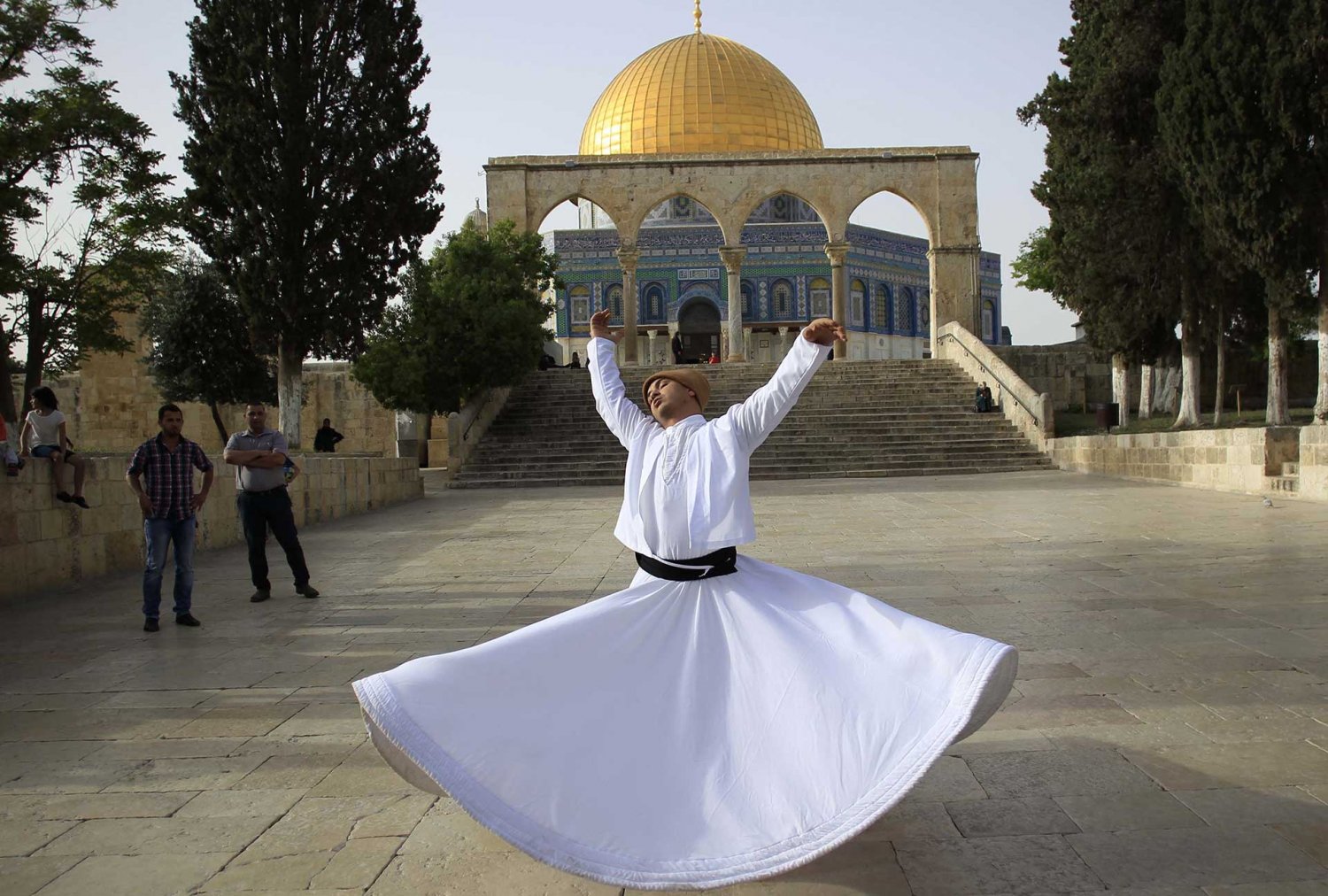 A whirling dervish performs at the Dome of the Rock in Jerusalem during the Nabi Musa festival, April 2016.